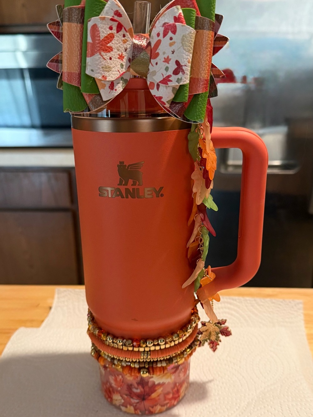 Stanley Orange Travel Mug “ dressed” with 10 piece homemade bling 30 oz